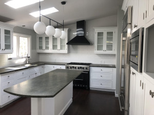 We have seen quite a few homeowners modernize their kitchens in recent months. Monochromatic palates, clean lines in cabinetry and glossy accents all seem to be the preferred stylistic choices this season.